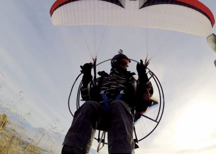 Paramotor Over Snowy Marshes